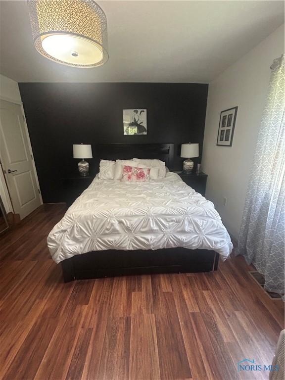 1020 Fremont Ave, Findlay, OH 45840 - bedroom featuring dark wood finished floors