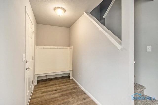 30619 Drouillard Rd, Walbridge, OH 43465 - entryway with wood finished floors, stairs, and a textured ceiling