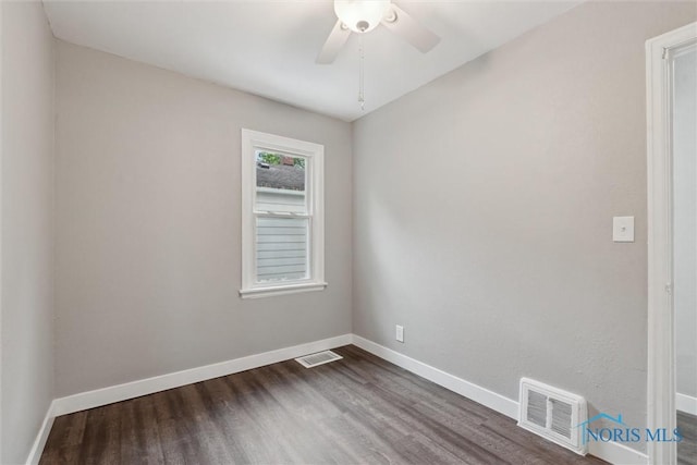2713 Stateview Dr, Toledo, OH 43609 - unfurnished room with dark wood-type flooring and ceiling fan