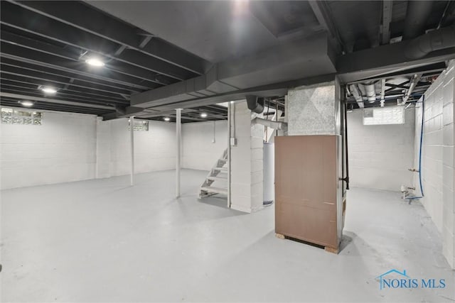 2713 Stateview Dr, Toledo, OH 43609 - basement featuring water heater and stairway