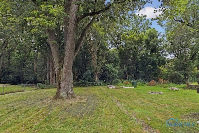 2713 Stateview Dr, Toledo, OH 43609 - view of yard featuring an outdoor fire pit