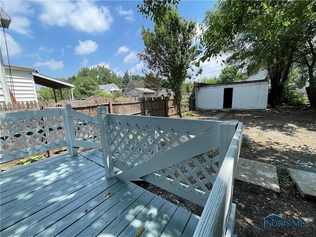 1221 E Broadway St, Toledo, OH 43605 - wooden deck featuring a storage unit