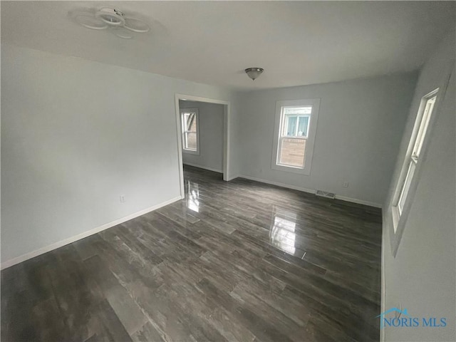 1221 E Broadway St, Toledo, OH 43605 - unfurnished room with dark wood-style flooring