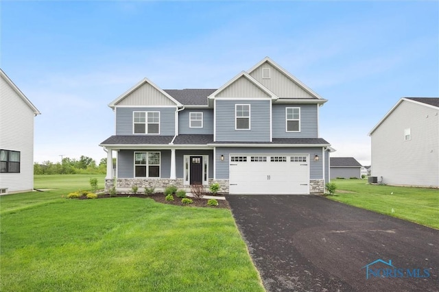 2700 Cross Ridge Way, Perrysburg, OH 43551 - craftsman-style home featuring board and batten siding, stone siding, and driveway