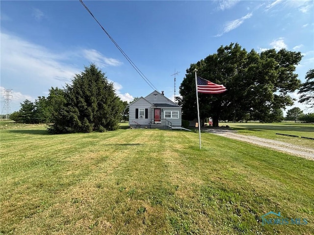 3706 Corduroy Rd, Oregon, OH 43616 - view of front of home with a front lawn and driveway
