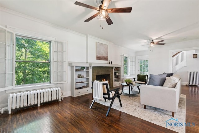 1673 Watova Rd, Toledo, OH 43614 - living area featuring radiator, ceiling fan, wood finished floors, and crown molding
