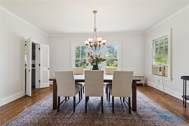 1673 Watova Rd, Toledo, OH 43614 - dining room featuring a chandelier, ornamental molding, radiator, dark wood finished floors, and cooling unit