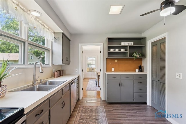 1673 Watova Rd, Toledo, OH 43614 - kitchen featuring gray cabinetry, dark wood-type flooring, dishwasher, and light countertops