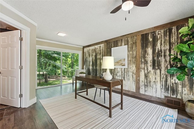1673 Watova Rd, Toledo, OH 43614 - home office with a textured ceiling, a ceiling fan, wood finished floors, crown molding, and wood walls