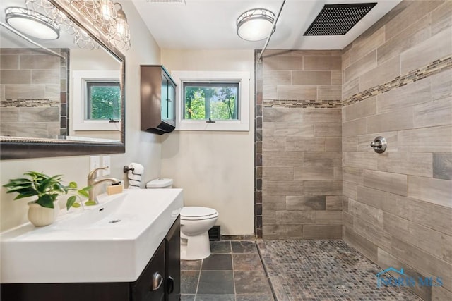 1673 Watova Rd, Toledo, OH 43614 - bathroom with a tile shower and vanity