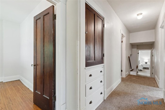 1673 Watova Rd, Toledo, OH 43614 - corridor featuring baseboards and light wood-type flooring