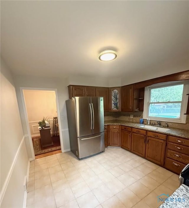 125 E Yates Ave, Findlay, OH 45840 - kitchen featuring freestanding refrigerator, light tile patterned flooring, light stone countertops, and open shelves