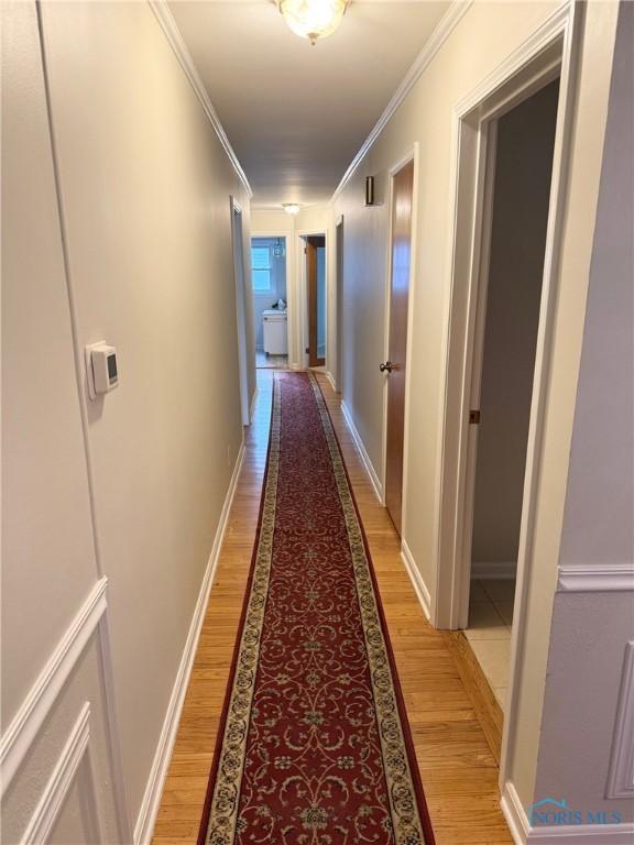 125 E Yates Ave, Findlay, OH 45840 - hall with light wood-style floors and crown molding