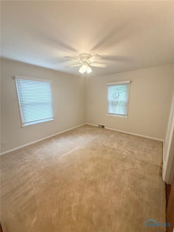 125 E Yates Ave, Findlay, OH 45840 - empty room featuring light colored carpet and a ceiling fan