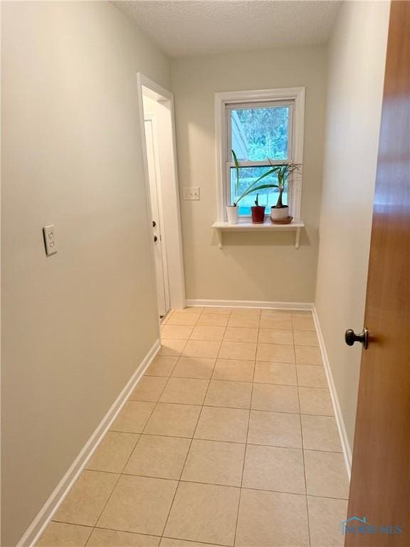 125 E Yates Ave, Findlay, OH 45840 - hall featuring light tile patterned flooring and a textured ceiling