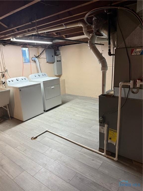 125 E Yates Ave, Findlay, OH 45840 - unfinished basement with washing machine and clothes dryer, heating unit, and wood finished floors