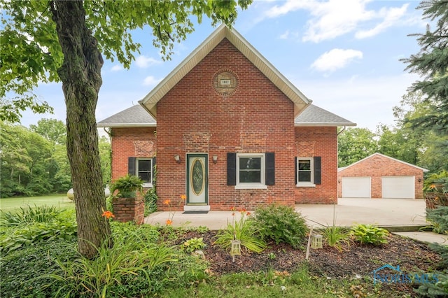 21010 Lemoyne Rd, Luckey, OH 43443 - traditional home featuring brick siding, an outdoor structure, and a garage