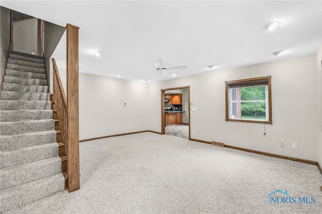 21010 Lemoyne Rd, Luckey, OH 43443 - below grade area with carpet floors, stairway, ceiling fan, and recessed lighting