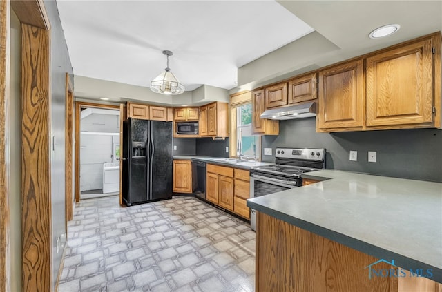 21010 Lemoyne Rd, Luckey, OH 43443 - kitchen featuring black appliances, under cabinet range hood, hanging light fixtures, and brown cabinetry