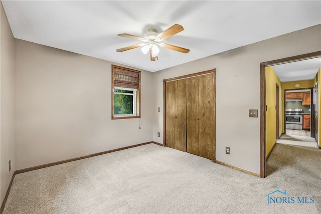 21010 Lemoyne Rd, Luckey, OH 43443 - unfurnished bedroom featuring carpet, a closet, and ceiling fan