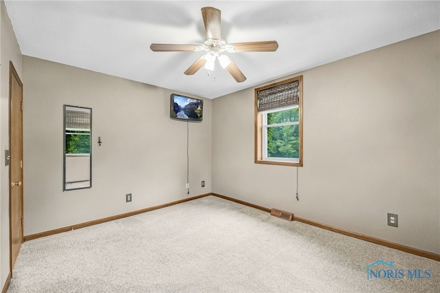 21010 Lemoyne Rd, Luckey, OH 43443 - spare room featuring ceiling fan and carpet floors