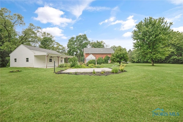 21010 Lemoyne Rd, Luckey, OH 43443 - view of grassy yard featuring ceiling fan