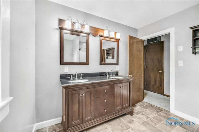 21010 Lemoyne Rd, Luckey, OH 43443 - bathroom with double vanity and baseboards