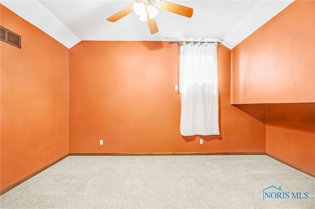 21010 Lemoyne Rd, Luckey, OH 43443 - carpeted empty room with vaulted ceiling and a ceiling fan