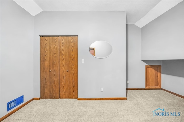 21010 Lemoyne Rd, Luckey, OH 43443 - unfurnished bedroom with vaulted ceiling and carpet flooring