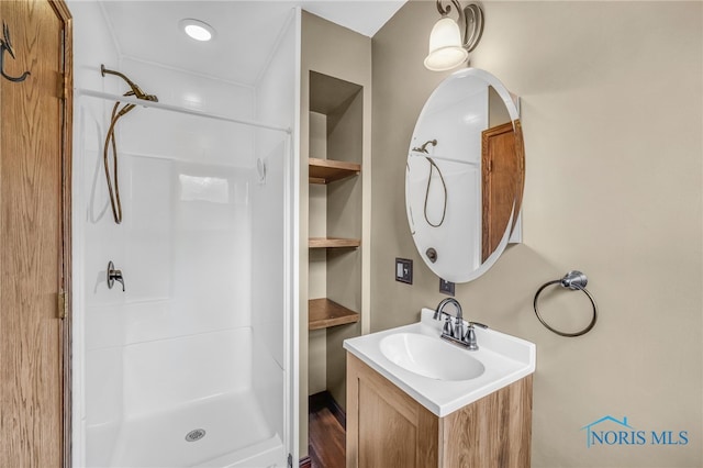 21010 Lemoyne Rd, Luckey, OH 43443 - bathroom featuring a stall shower and vanity