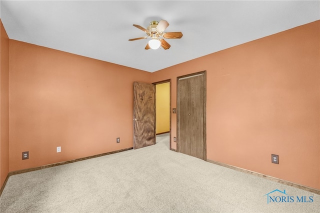 21010 Lemoyne Rd, Luckey, OH 43443 - carpeted empty room featuring a ceiling fan and baseboards