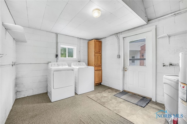 21010 Lemoyne Rd, Luckey, OH 43443 - laundry room featuring cabinet space, separate washer and dryer, concrete block wall, and gas water heater