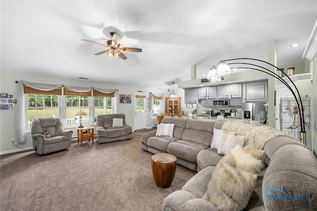 14 White Tail Way Unit A, Norwalk, OH 44857 - carpeted living room featuring ceiling fan, vaulted ceiling, and a chandelier