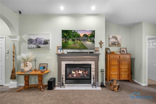 14 White Tail Way Unit A, Norwalk, OH 44857 - carpeted living room with a fireplace, arched walkways, and recessed lighting