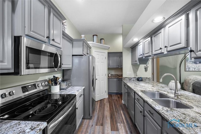 14 White Tail Way Unit A, Norwalk, OH 44857 - kitchen with appliances with stainless steel finishes, gray cabinets, dark wood finished floors, light stone countertops, and recessed lighting