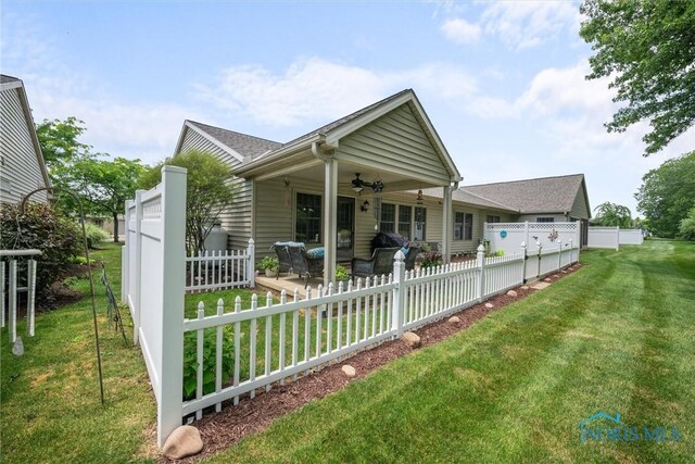 14 White Tail Way Unit A, Norwalk, OH 44857 - view of front of home featuring ceiling fan, a fenced backyard, and a patio area