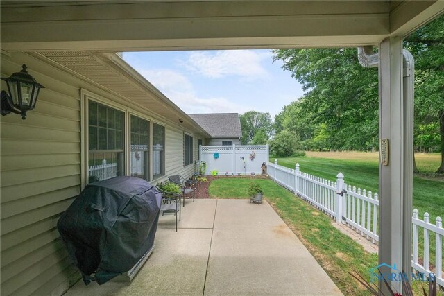 14 White Tail Way Unit A, Norwalk, OH 44857 - fenced backyard featuring area for grilling and a patio