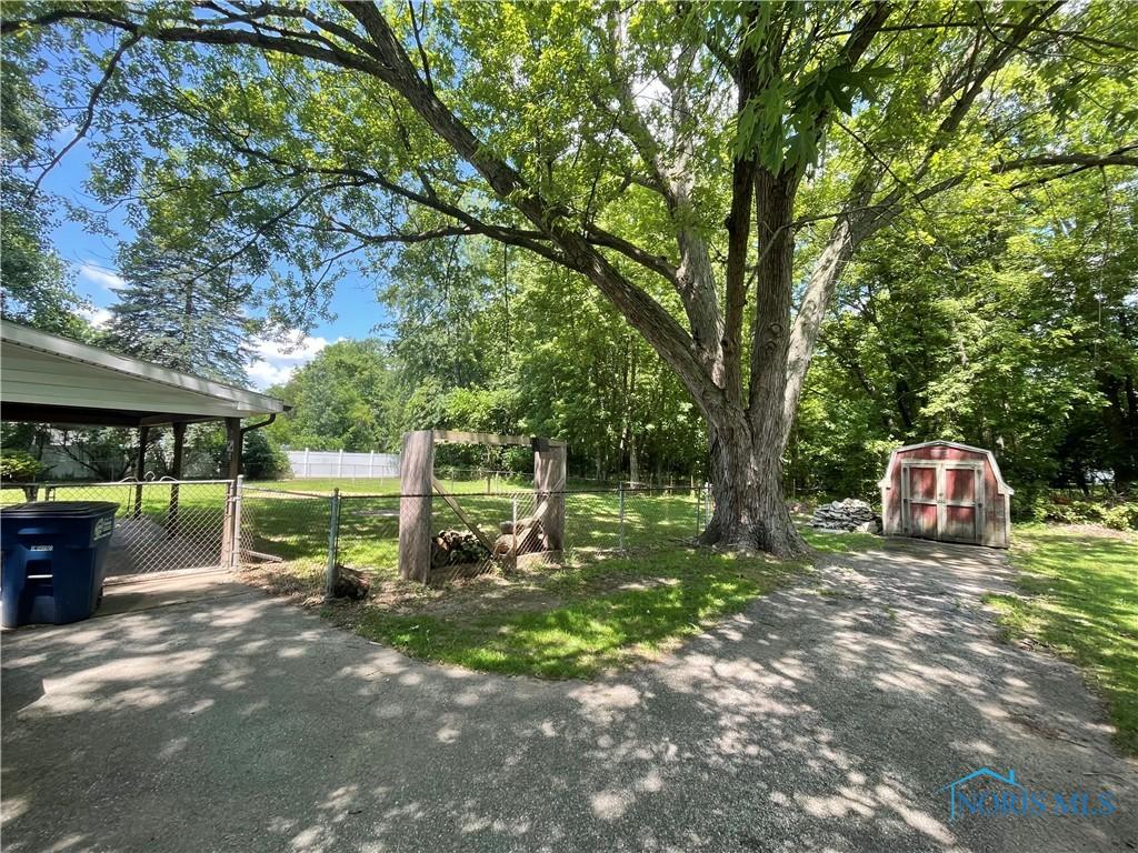 5626 Dorr St, Toledo, OH 43615 - view of yard with a shed and a gate