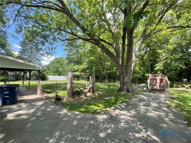 5626 Dorr St, Toledo, OH 43615 - view of yard with a shed and a gate