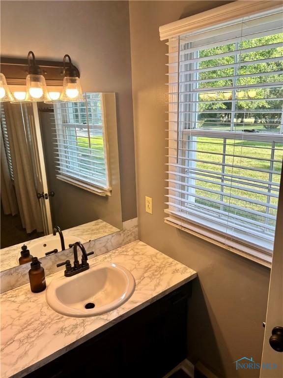 210 Duck Pond Rd, Upper Sandusky, OH 43351 - bathroom featuring vanity and healthy amount of natural light