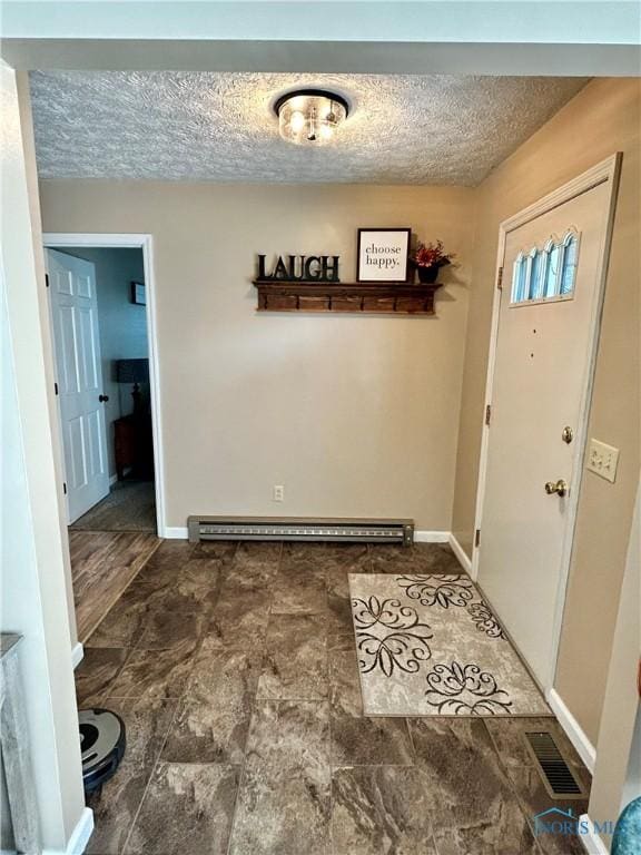 210 Duck Pond Rd, Upper Sandusky, OH 43351 - entryway featuring baseboard heating and a textured ceiling