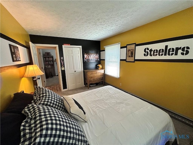 210 Duck Pond Rd, Upper Sandusky, OH 43351 - carpeted bedroom featuring a textured ceiling and a closet