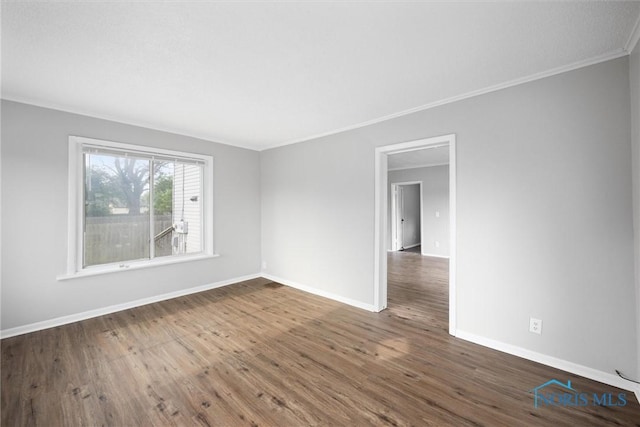 5520 N Summit St, Toledo, OH 43611 - unfurnished room with ornamental molding and dark wood-type flooring