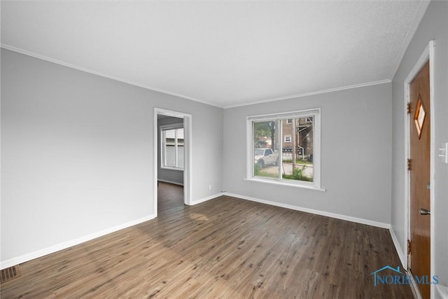 5520 N Summit St, Toledo, OH 43611 - spare room featuring wood finished floors and ornamental molding
