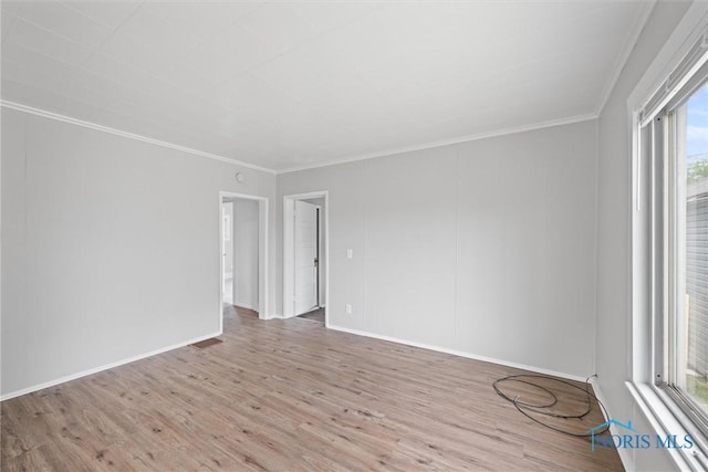 5520 N Summit St, Toledo, OH 43611 - spare room featuring wood finished floors and crown molding