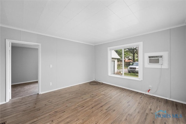 5520 N Summit St, Toledo, OH 43611 - spare room featuring crown molding, wood finished floors, and a wall mounted AC