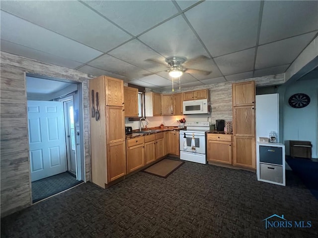 8872 Rd 87, Paulding, OH 45879 - kitchen featuring white appliances, dark carpet, a drop ceiling, ceiling fan, and dark countertops
