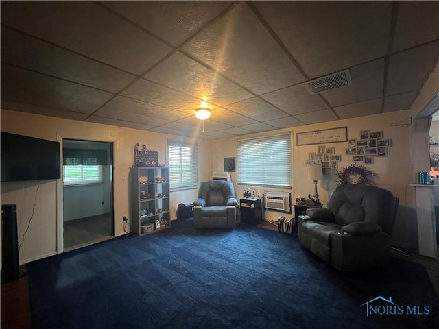 8872 Rd 87, Paulding, OH 45879 - living area with carpet floors, a drop ceiling, and a wall mounted air conditioner