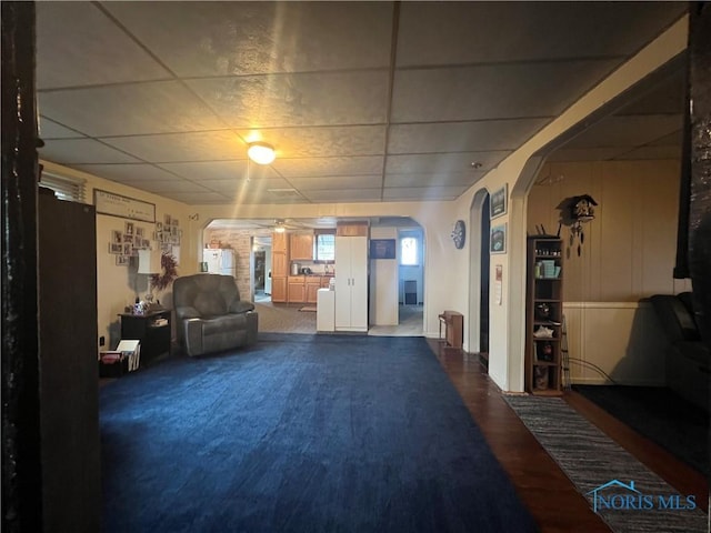 8872 Rd 87, Paulding, OH 45879 - living room featuring arched walkways, ceiling fan, and a drop ceiling