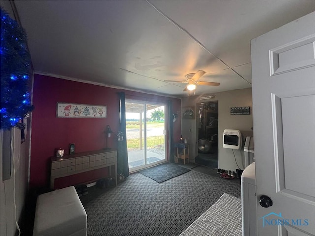 8872 Rd 87, Paulding, OH 45879 - doorway to outside featuring a ceiling fan, carpet flooring, and heating unit
